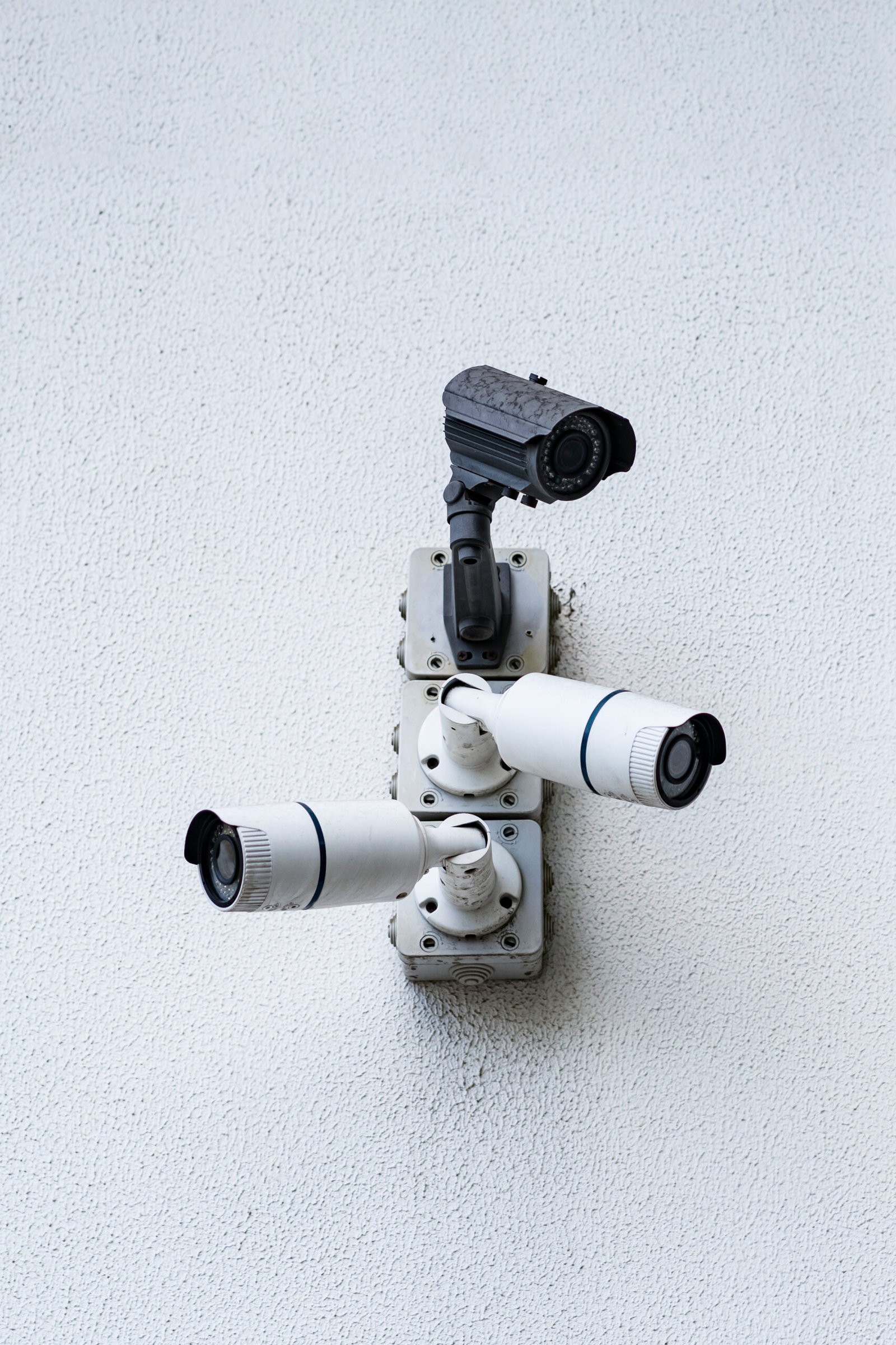 Security cameras on white modern building, technology concept